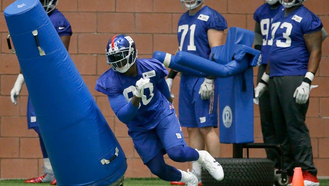 May 25, 2017; East Rutherford, NJ, USA;  New York Giants defensive end Jason Pierre-Paul (90) runs through blocking dummies during OTA practice at Quest Diagnostics Training Center.