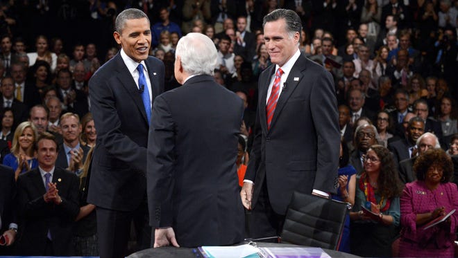 Romney and Obama shake hands with moderator Bob Schieffer following the third presidential debate on Oct. 22, 2012, at Lynn University in Boca Raton, Fla.