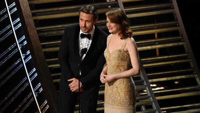 Ryan Gosling and Emma Stone introduce John Legend as he sings a medley of the oscar nominated songs from 'La La Land' during the 89th Academy Awards.