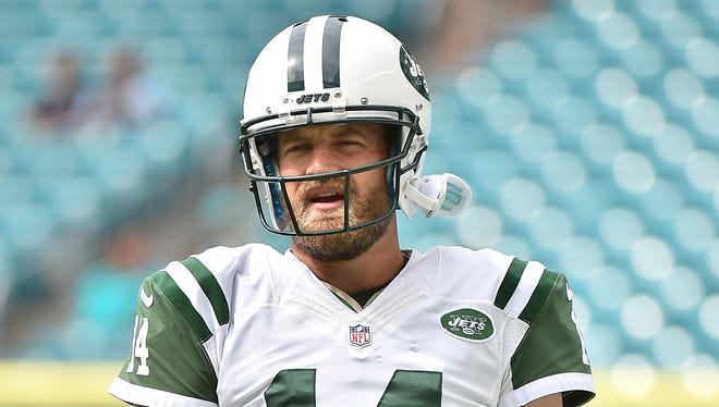 New York Jets quarterback Ryan Fitzpatrick (14) warms up before the game against the Miami Dolphins at Hard Rock Stadium.