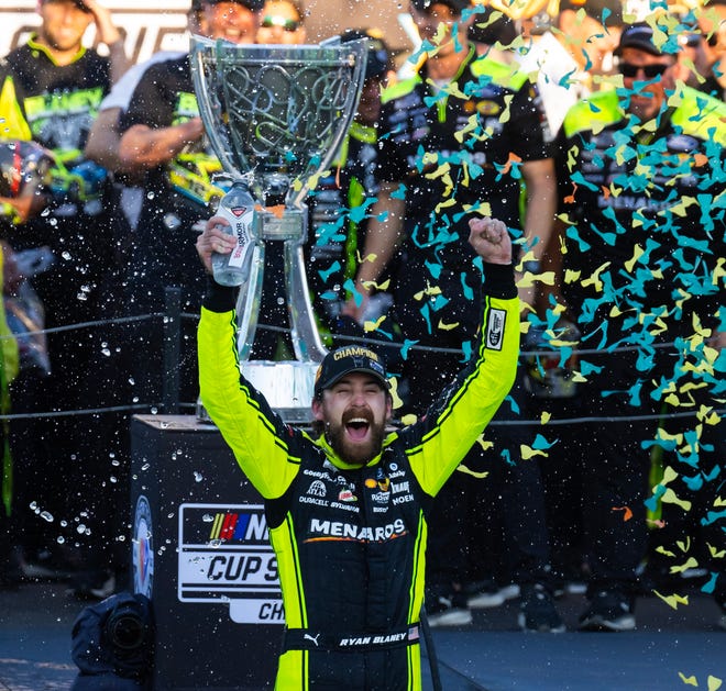 Ryan Blaney celebrates after winning the 2023 NASCAR Cup Series championship at Phoenix Raceway. Blaney hails from High Point, North Carolina.