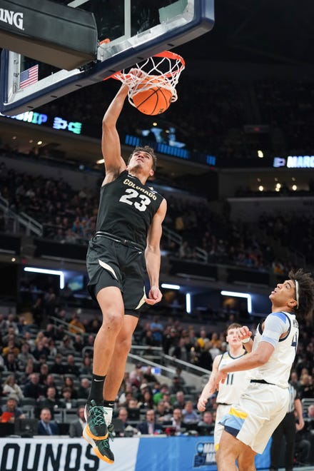 Colorado Buffaloes forward Tristan da Silva (23) dunks the ball against the Marquette Golden Eagles during the first half of the NCAA Tournament second-round game on March 24, 2024, at Gainbridge FieldHouse in Indianapolis.