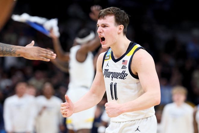 Tyler Kolek #11 of the Marquette Golden Eagles celebrates after defeating the Colorado Buffaloes in the second round of the NCAA Men's Basketball Tournament at Gainbridge Fieldhouse on March 24, 2024 in Indianapolis, Indiana.
