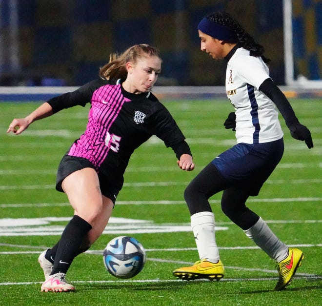Kettle Moraine's Kendal Moore (15) works to get past Brookfield Academy's Shivani Shah (25) during the match at Kettle Moraine on Friday, April 5, 2024.