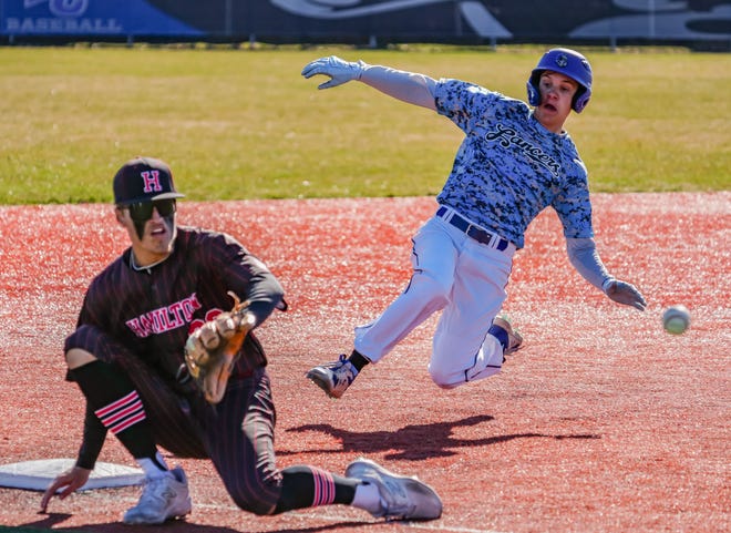 Brookfield Central's Sam Guy (12) steals third as Sussex Hamilton's Nate Vaughan (20) waits on the throw from home at Brookfield on Saturday, April 6, 2024.