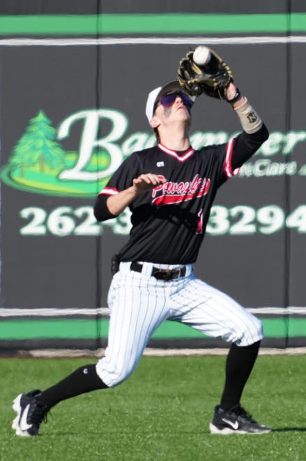 Pewaukee right fielder Logan Peterson (1) pulls in a fly ball during the game against Oconomowoc at Dockhounds Stadium in Oconomowoc, Wednesday, April 24, 2024.