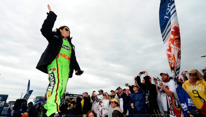Danica Patrick waves to fans during driver introductions prior to the start of the NASCAR Sprint Cup Series Daytona 500 at Daytona International Speedway on February 26, 2012 in Daytona Beach, Florida.