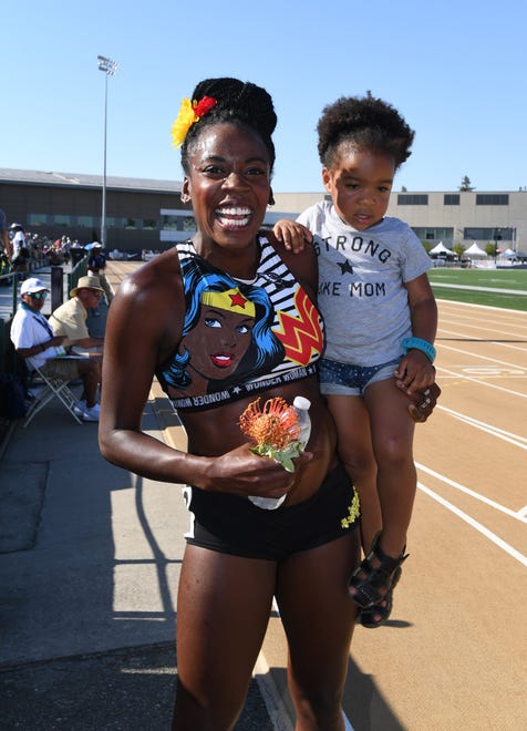 Alysia Montano holds her daughter, Linnea Montano, after running while four months pregnant during the USA Championships in 2017.