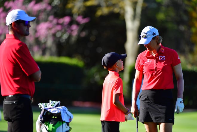 Annika Sorenstam of Sweden talks with her son while practicing her chipping prior to the final round of the Gainbridge LPGA at Lake Nona Golf and Country Club on February 28, 2021 in Orlando.